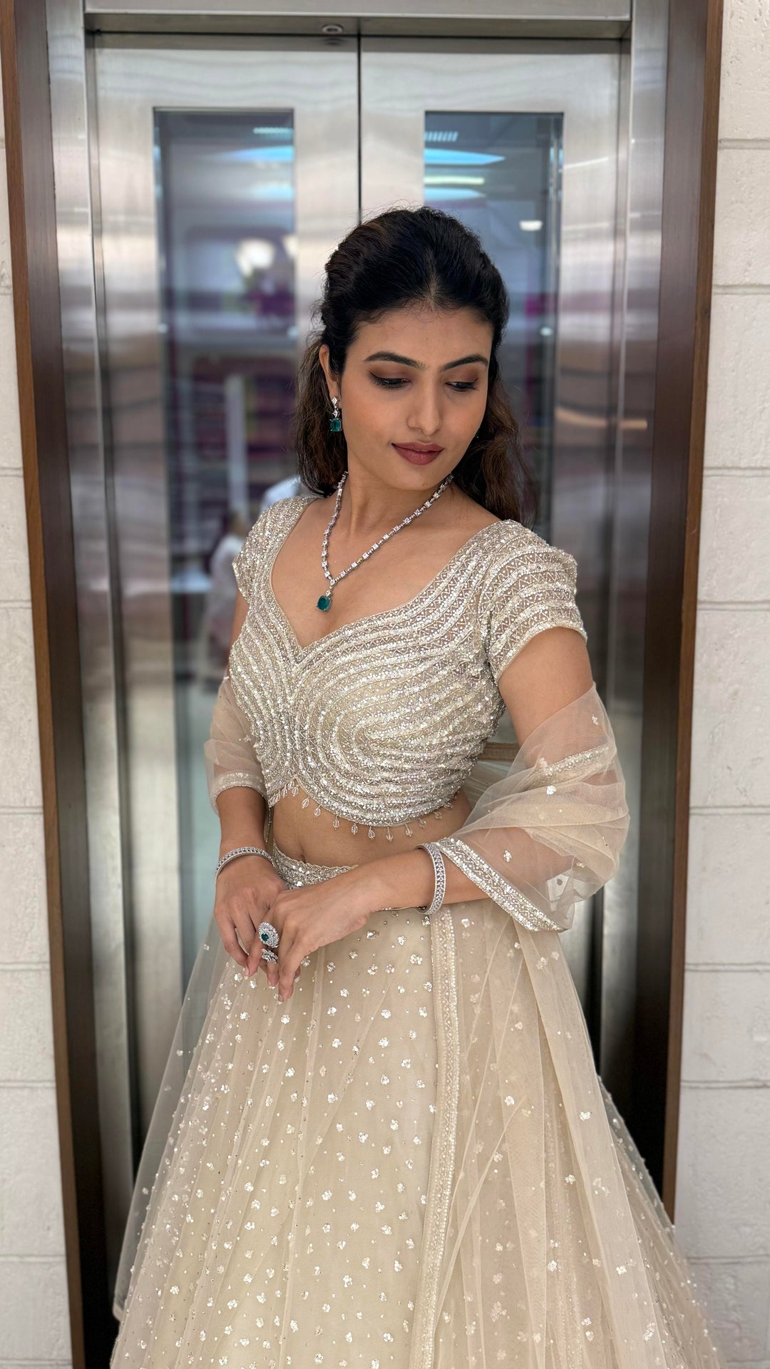 Champagne Sequin Embellished Lehenga with Wave Pattern Blouse & Sheer Dupatta