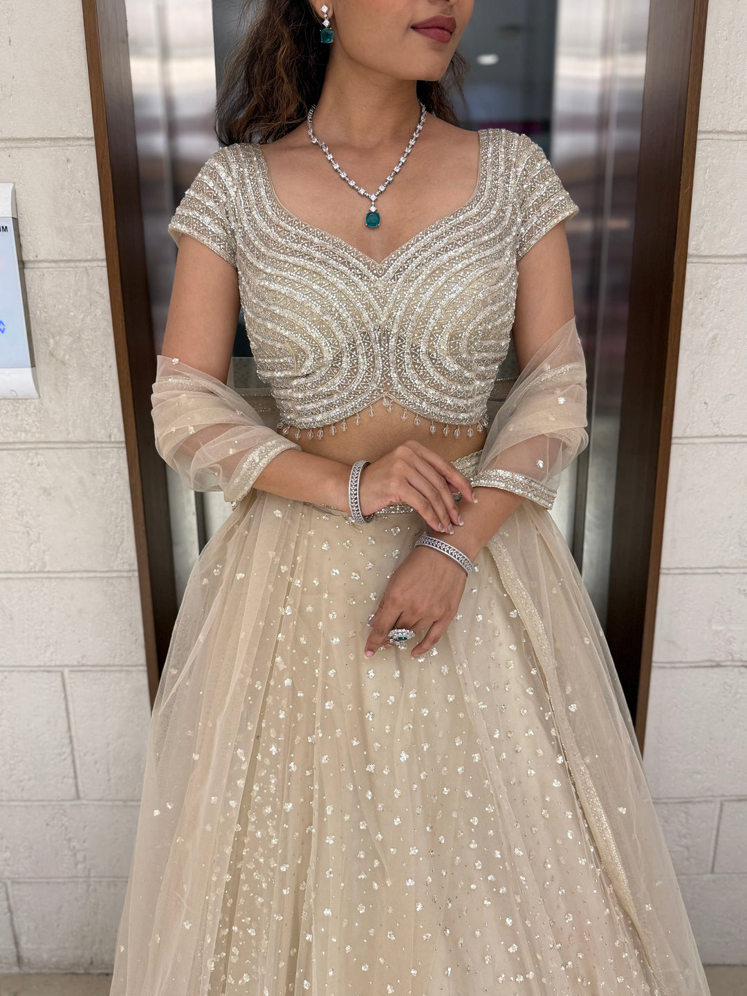 Champagne Sequin Embellished Lehenga with Wave Pattern Blouse & Sheer Dupatta