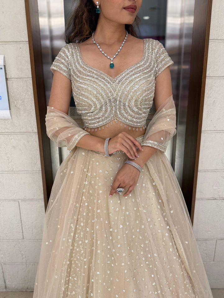 Champagne Sequin Embellished Lehenga with Wave Pattern Blouse & Sheer Dupatta