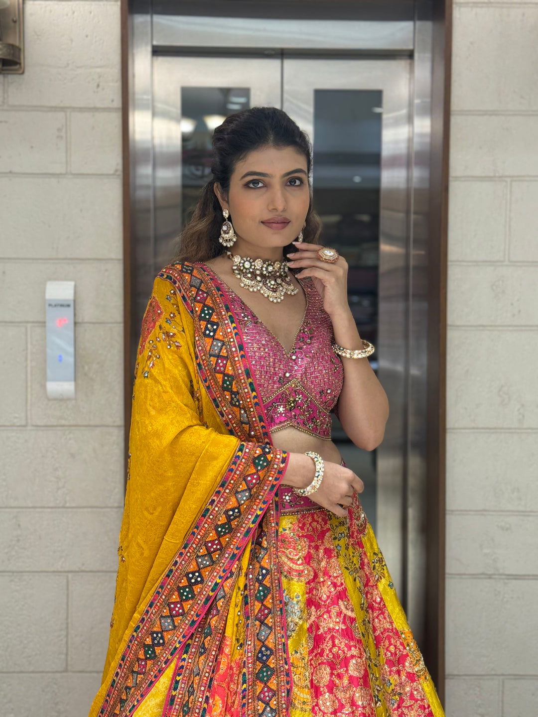 Rani Pink & Mustard Patola Print Mirror Work Lehenga with Hand-Embroidered Blouse