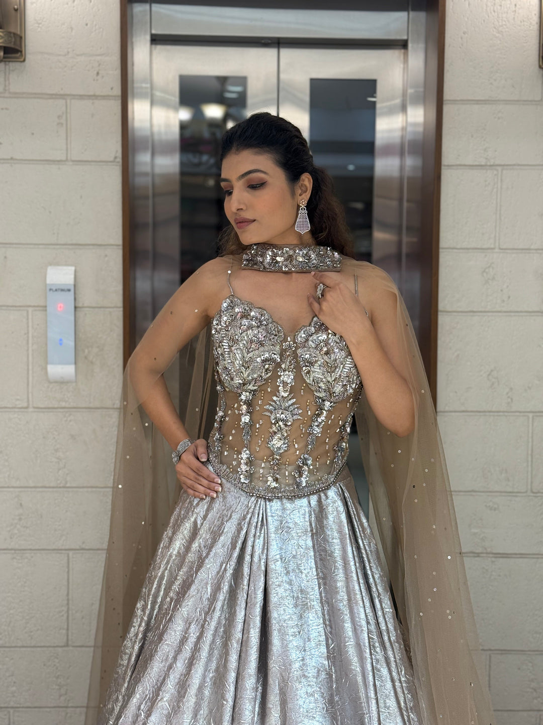 Metallic Silver Lehenga Choli with 3D Crystal Corset & Sheer Cape Dupatta