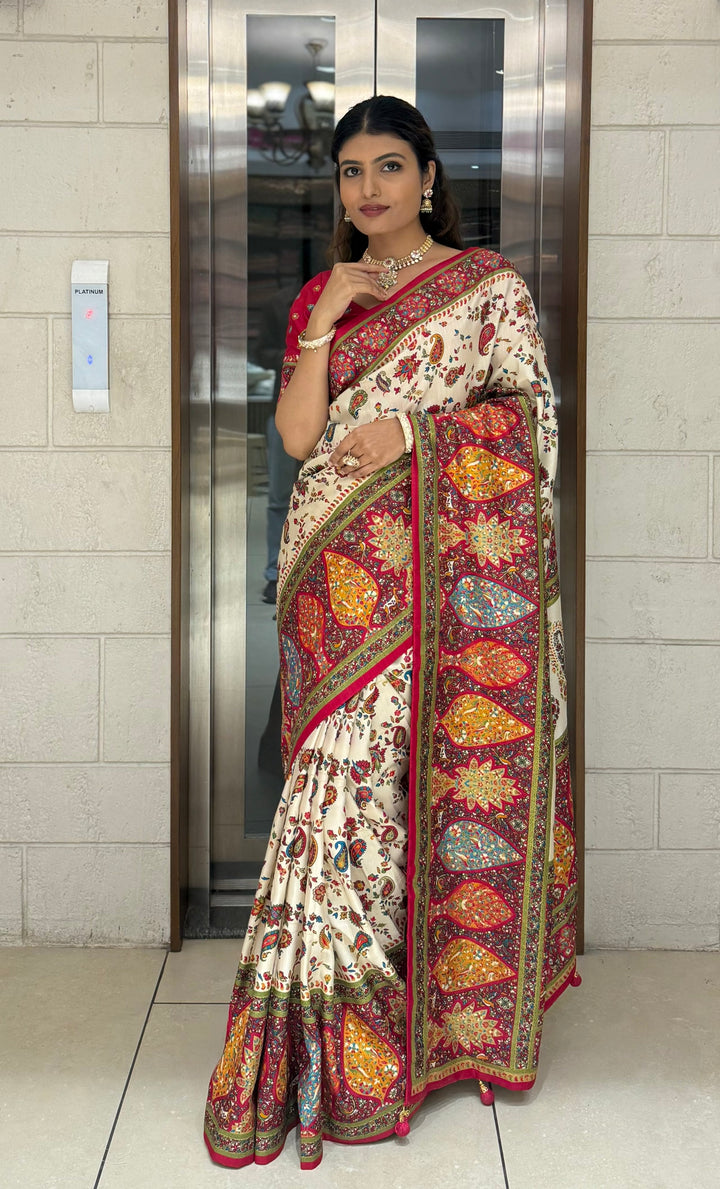Cream Silk Patola Print Saree with Hand-Embroidered Border & Tassels