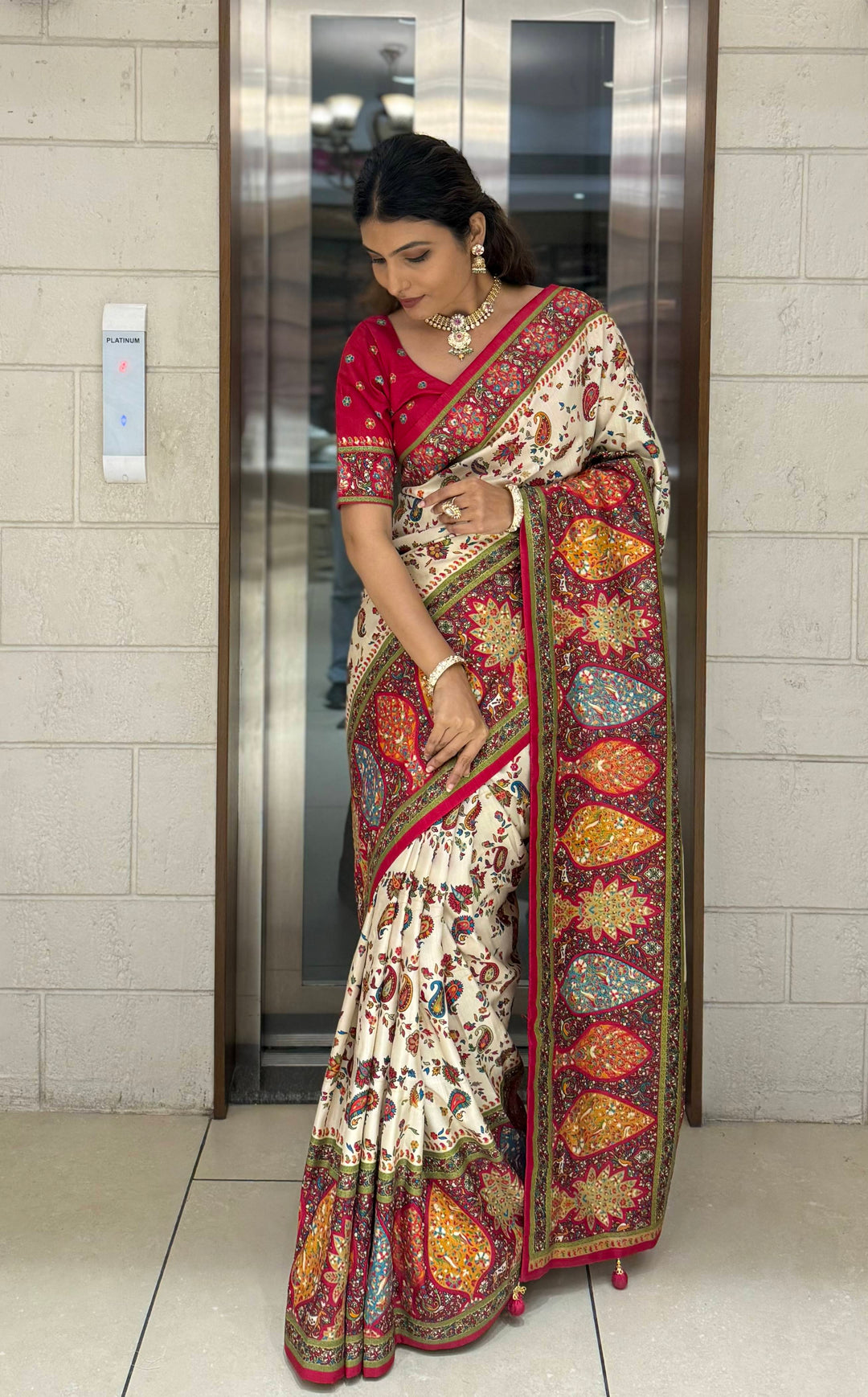 Cream Silk Patola Print Saree with Hand-Embroidered Border & Tassels