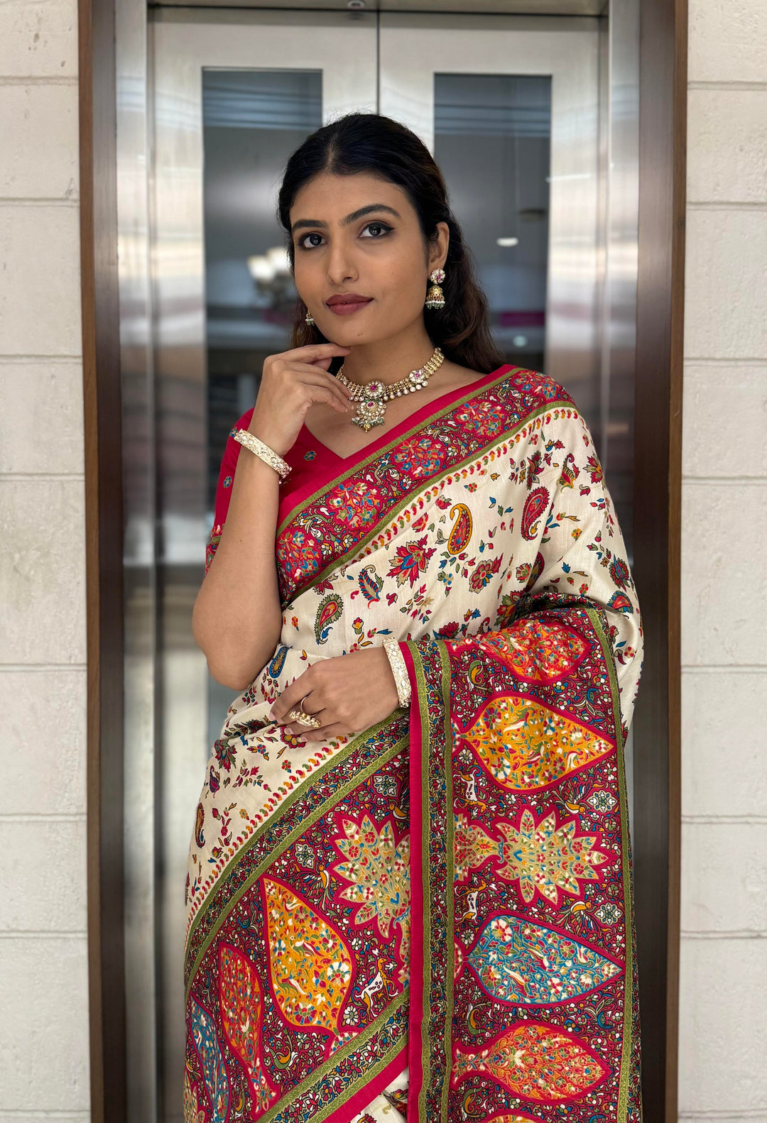 Cream Silk Patola Print Saree with Hand-Embroidered Border & Tassels