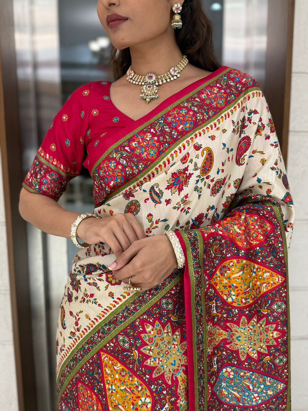 Cream Silk Patola Print Saree with Hand-Embroidered Border & Tassels