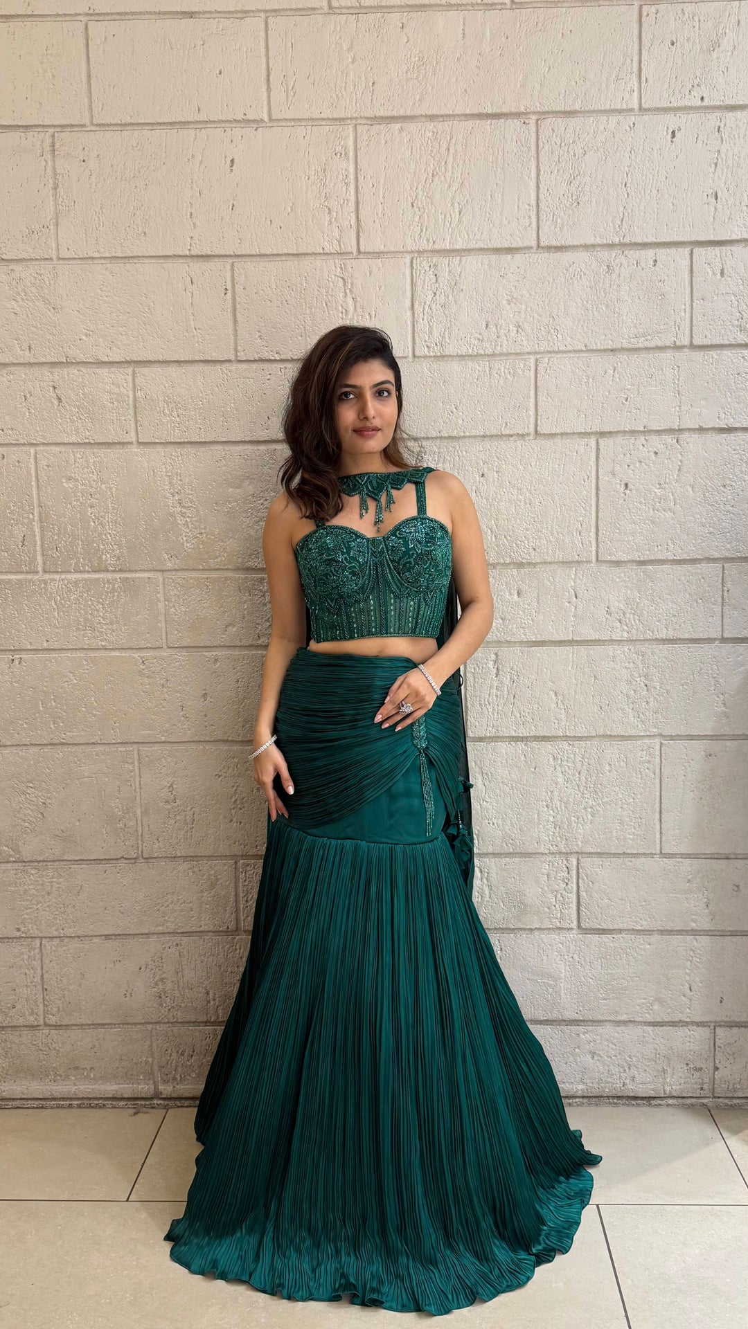 Emerald Green Designer Indo-Western Pleated Corset Blouse Lehenga with Hand-Embroidered Bustier Emerald Green Designer Indo-Western Pleated Corset Blouse Lehenga with Hand-Embroidered Bustier