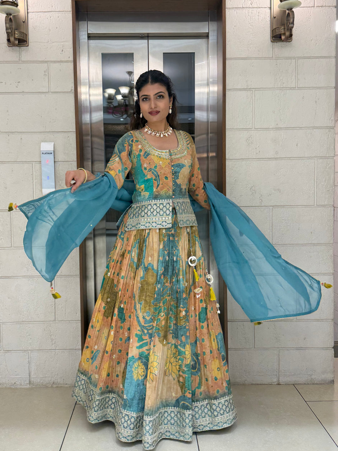 Teal Blue & Peach Printed Designer Peplum Lehenga Set with Flared Sleeves & Tassel Accents