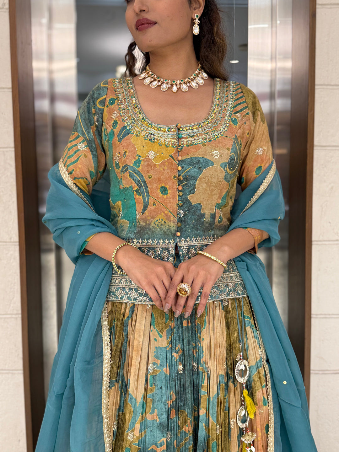 Teal Blue & Peach Printed Designer Peplum Lehenga Set with Flared Sleeves & Tassel Accents