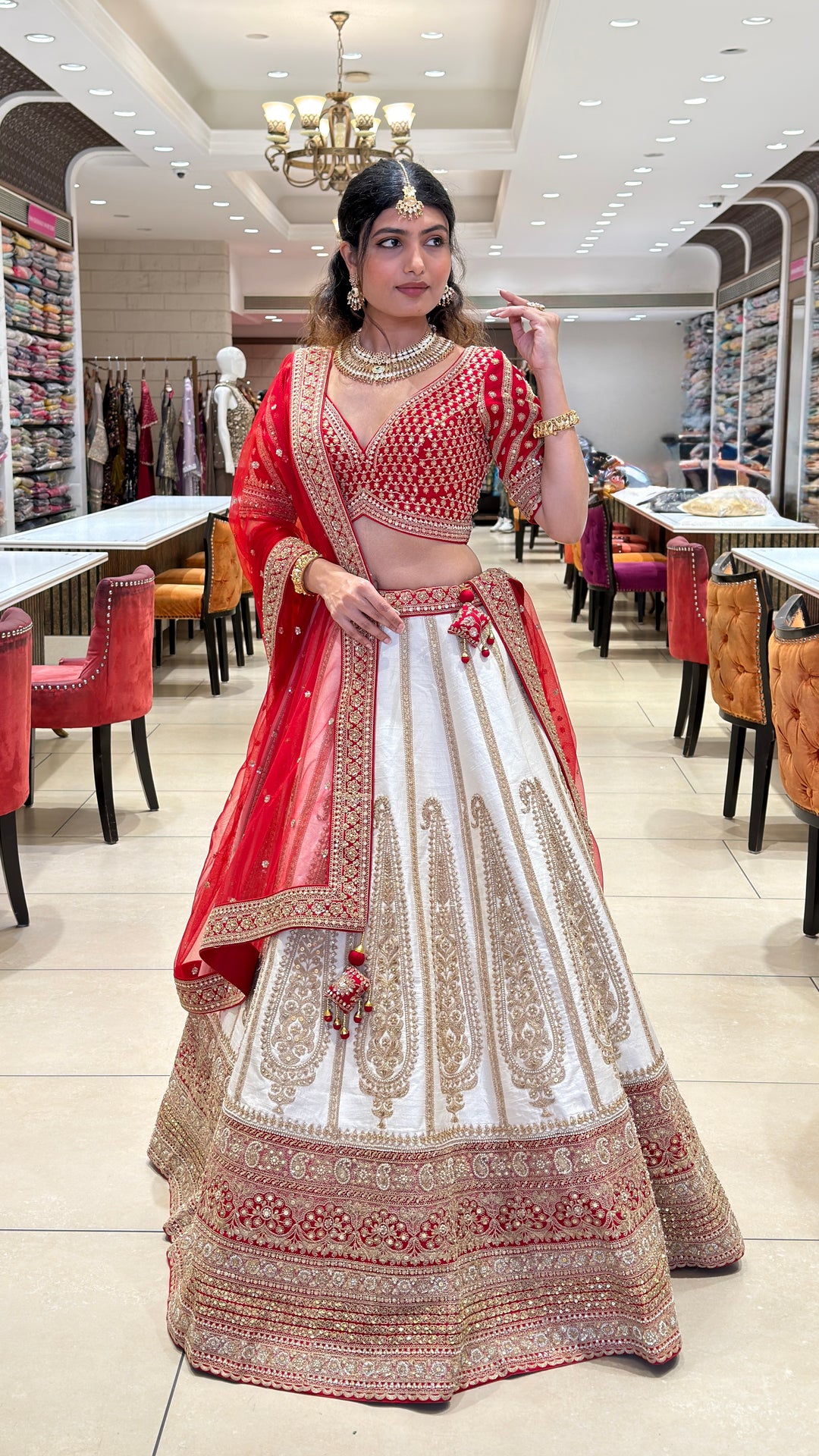 Ivory & Crimson Bridal Lehenga with Intricate Gold Embroidery and Designer Dupatta
