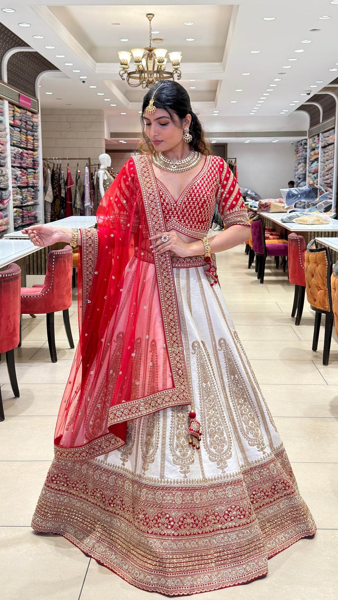 Ivory & Crimson Bridal Lehenga with Intricate Gold Embroidery and Designer Dupatta