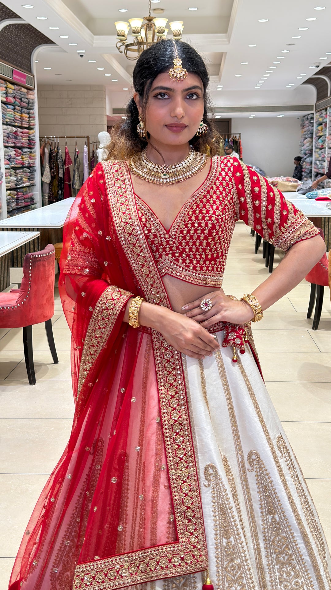 Ivory & Crimson Bridal Lehenga with Intricate Gold Embroidery and Designer Dupatta