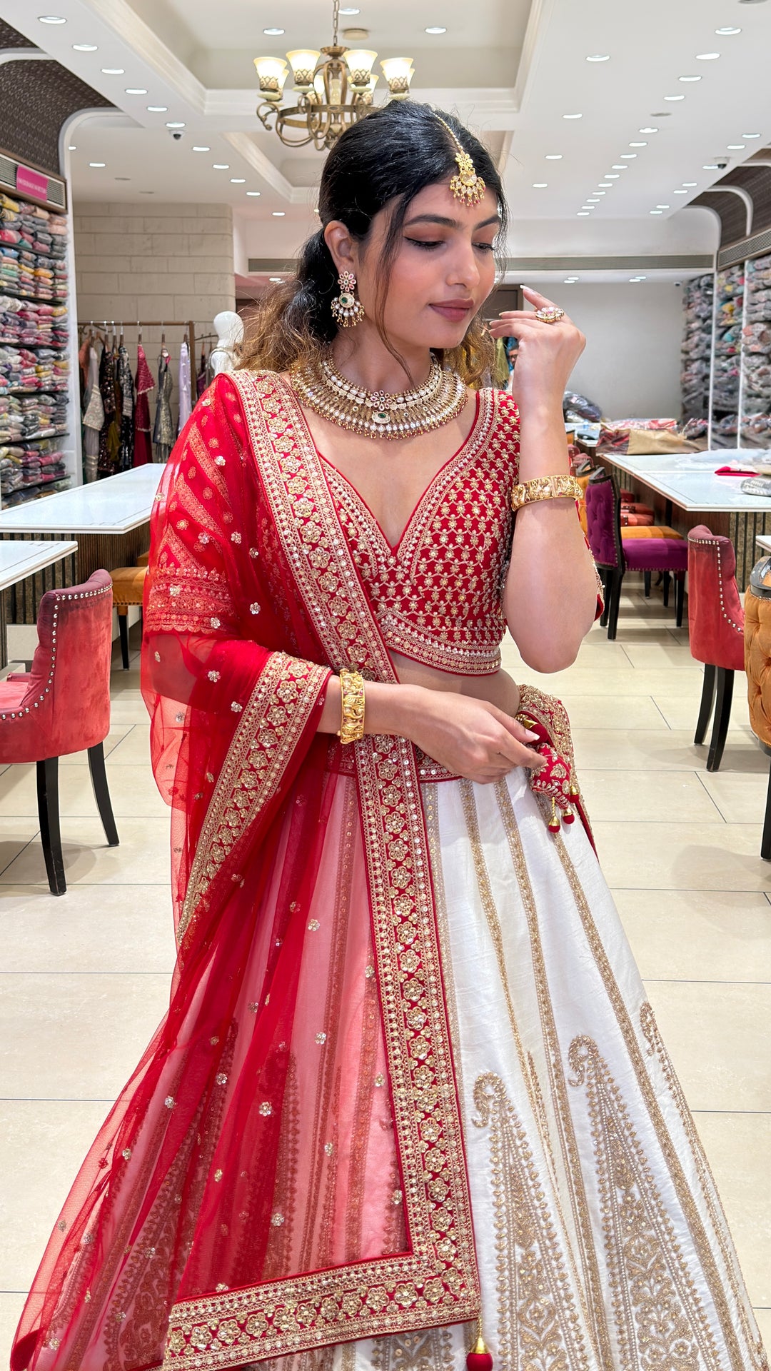 Ivory & Crimson Bridal Lehenga with Intricate Gold Embroidery and Designer Dupatta