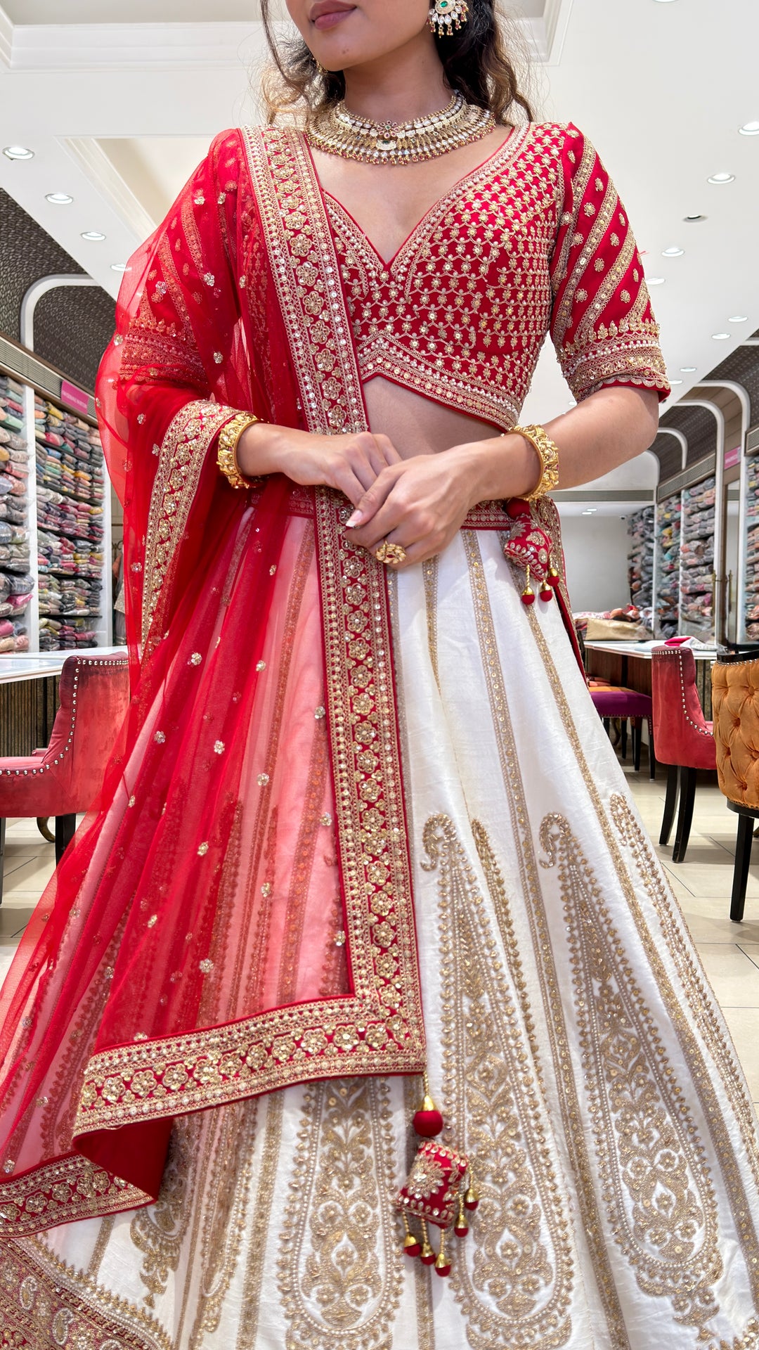 Ivory & Crimson Bridal Lehenga with Intricate Gold Embroidery and Designer Dupatta