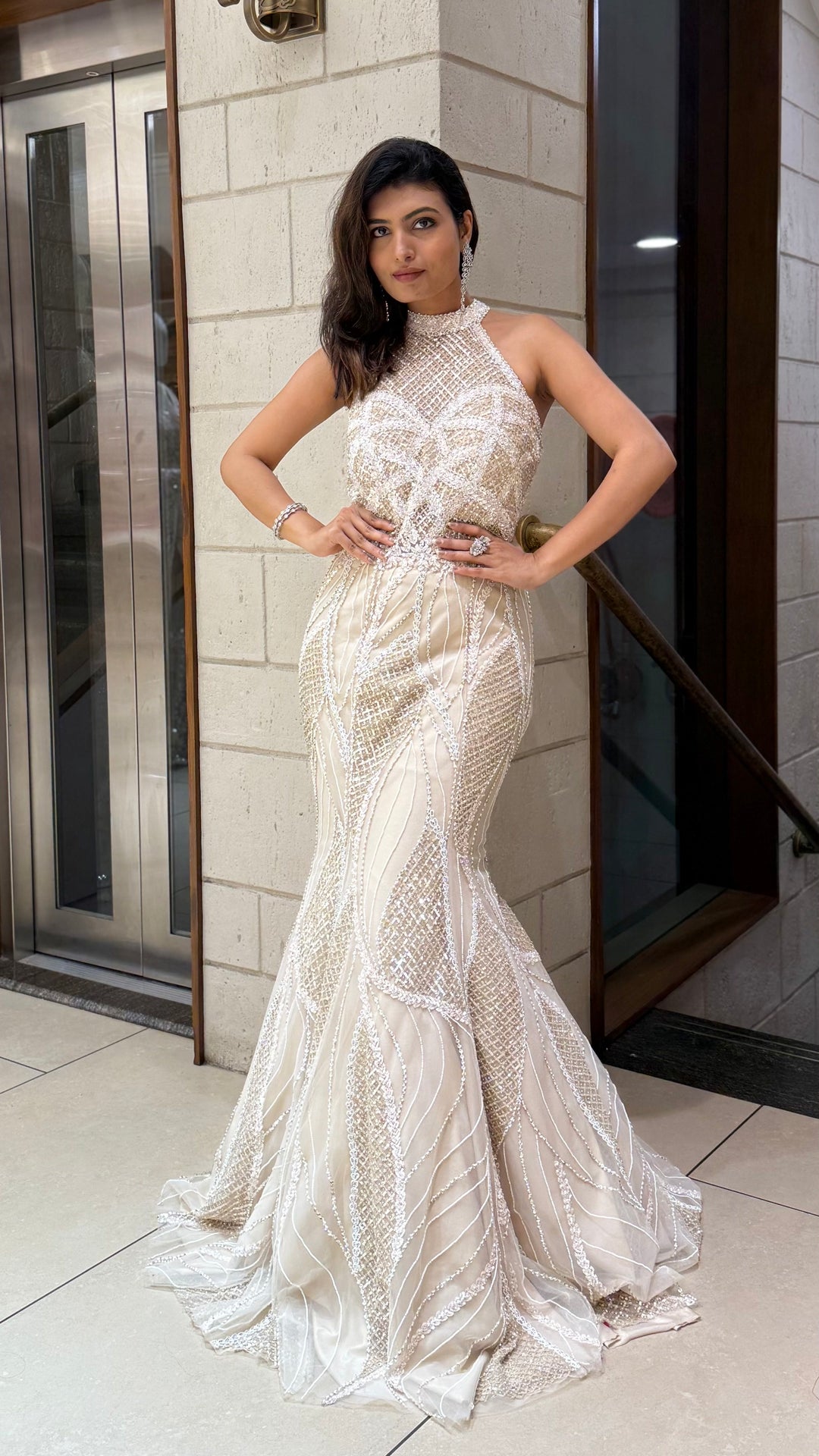 Ivory Champagne Sequin Fish Cut Mermaid Gown with Halter Neck Ivory Champagne Sequin Fish Cut Mermaid Gown with Halter Neck