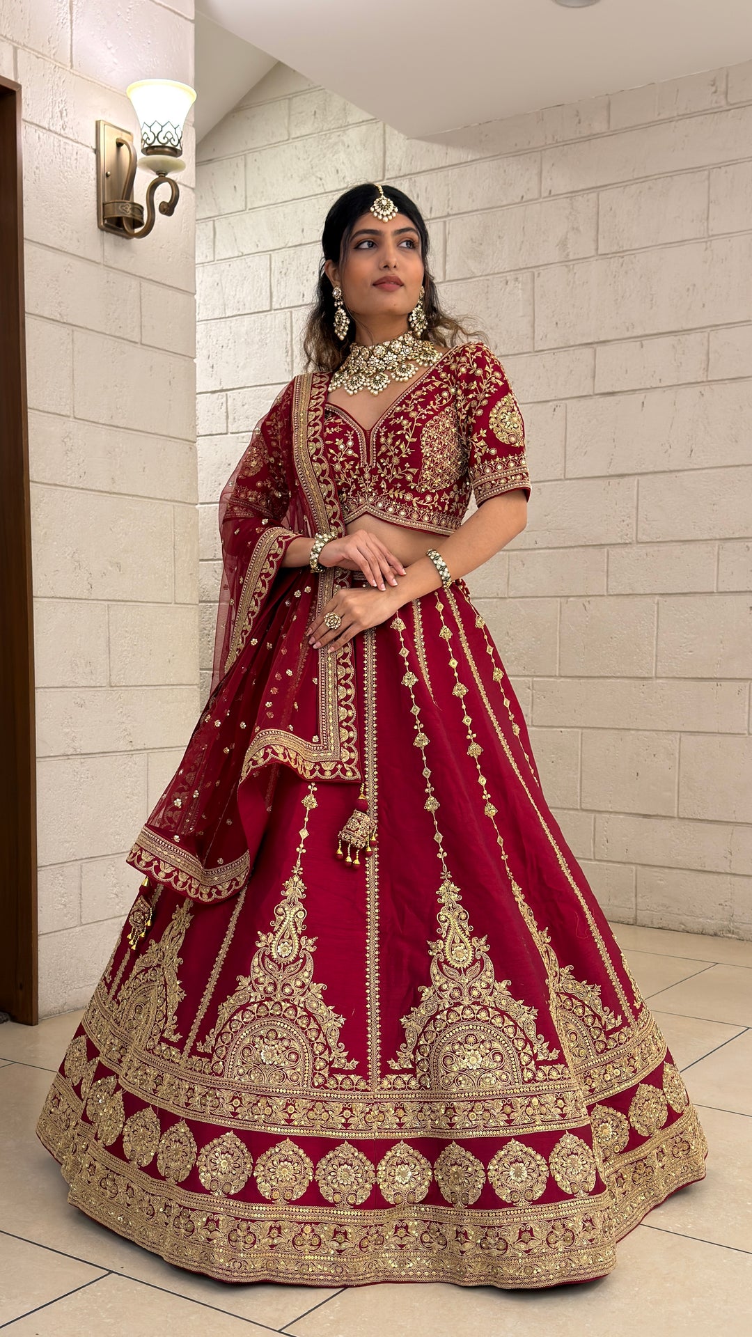 Wine Red Bridal Lehenga Set with Heavy Gold Embroidery & Designer Net Dupatta