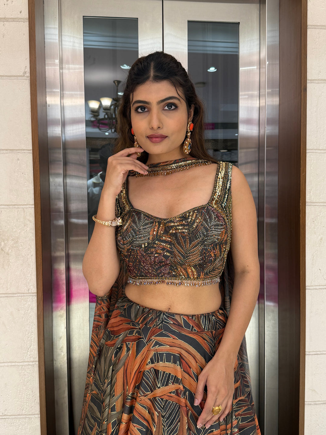 Rust Orange & Olive Leaf Print Lehenga with Embellished Blouse & Dupatta