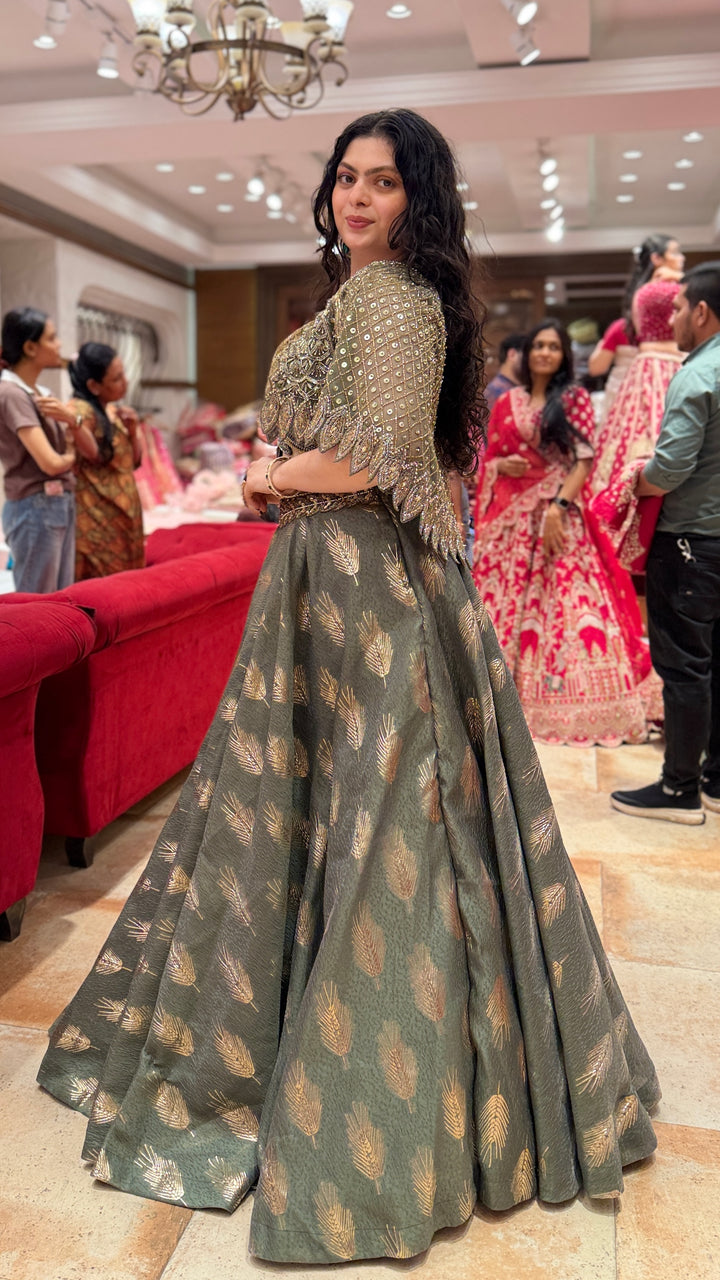 Olive Green Designer Lehenga Choli with Embellished Cape Sleeves