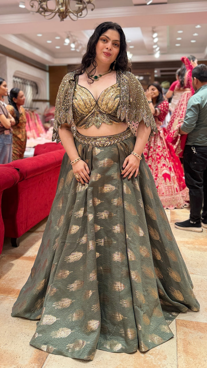 Olive Green Designer Lehenga Choli with Embellished Cape Sleeves