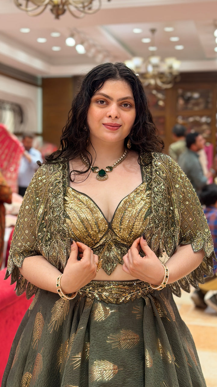 Olive Green Designer Lehenga Choli with Embellished Cape Sleeves