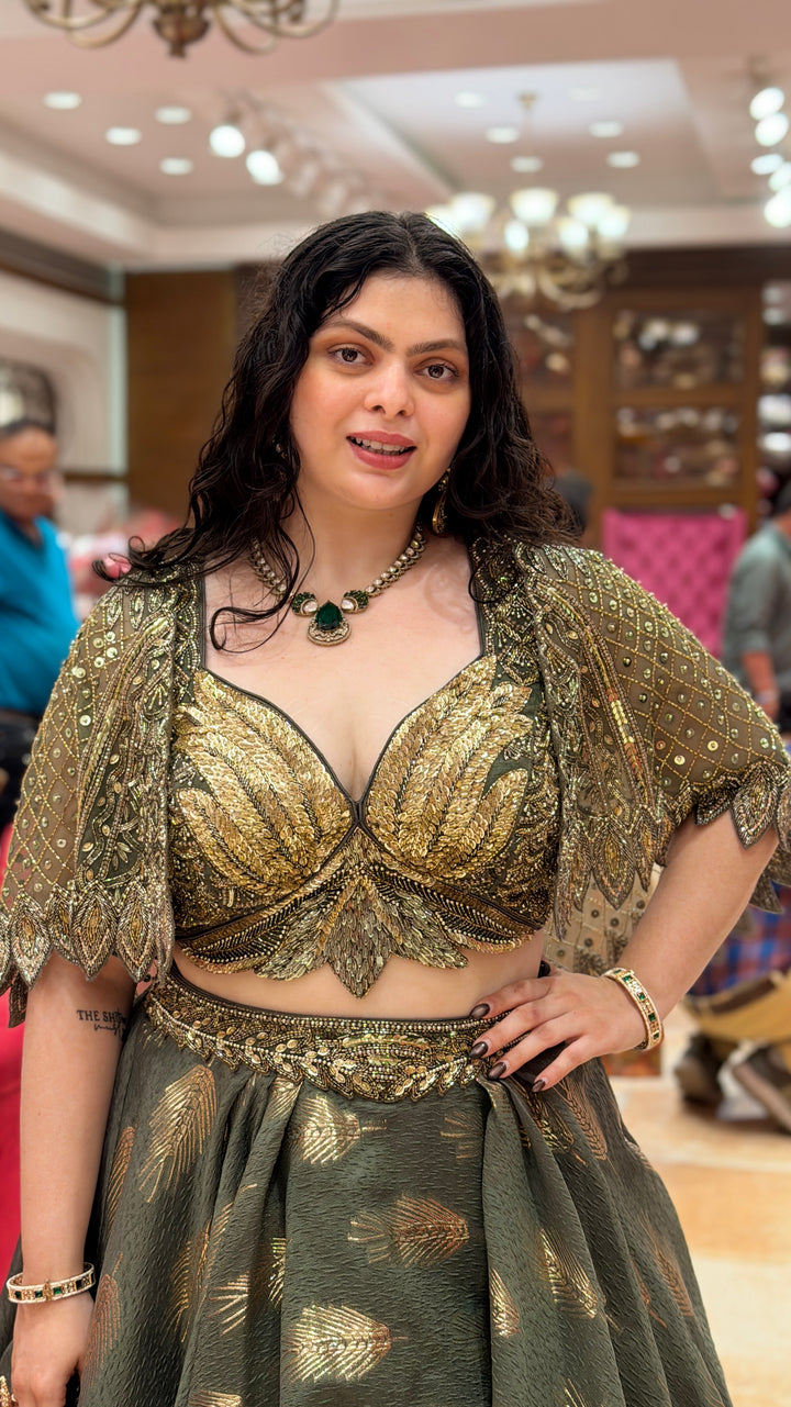 Olive Green Designer Lehenga Choli with Embellished Cape Sleeves