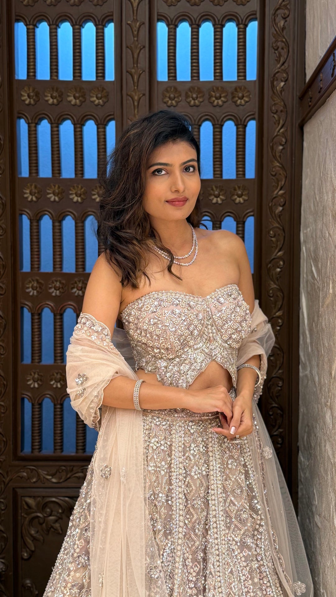 Champagne Ivory & Silver Embellished Lehenga with Corset Blouse & Net Dupatta