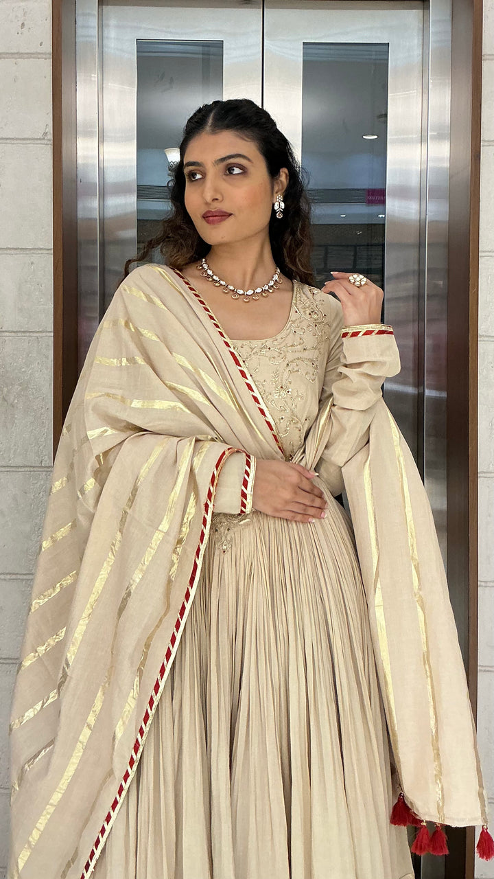 Elegant Beige Anarkali Suit Set with Tassel Dupatta