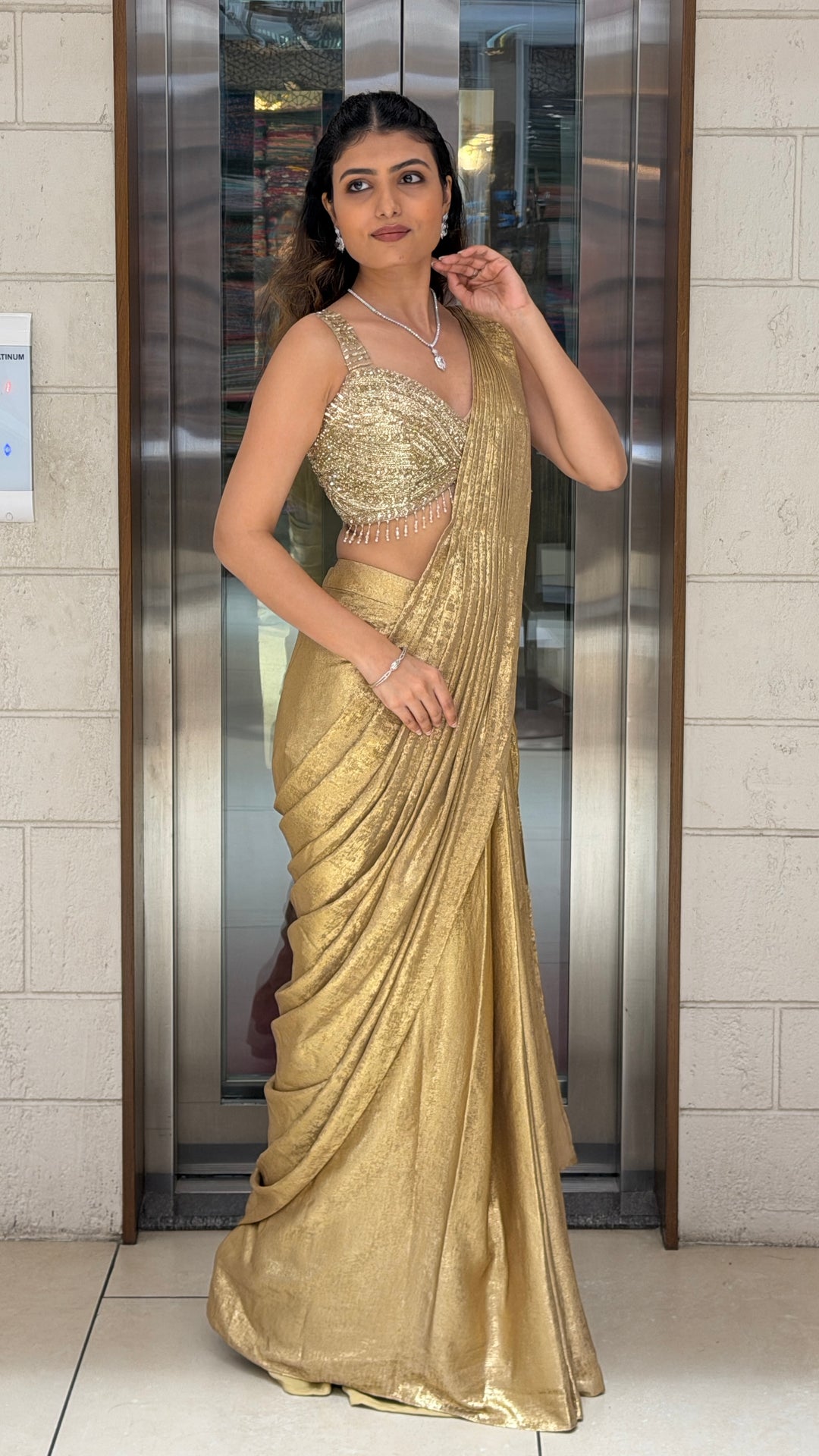 Golden Shimmer Designer Saree with Embellished Blouse