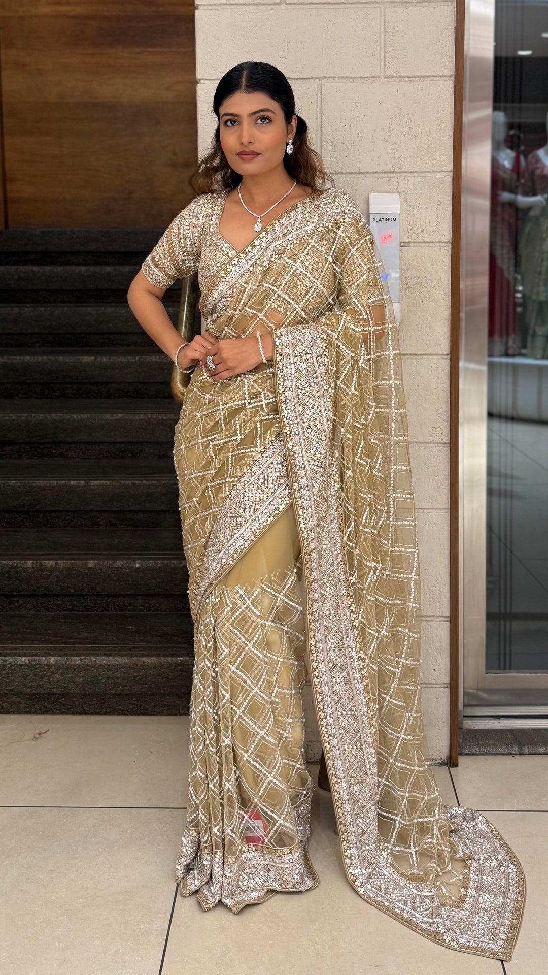 Champagne Gold Heavy Embroidered Net Saree with Matching Blouse