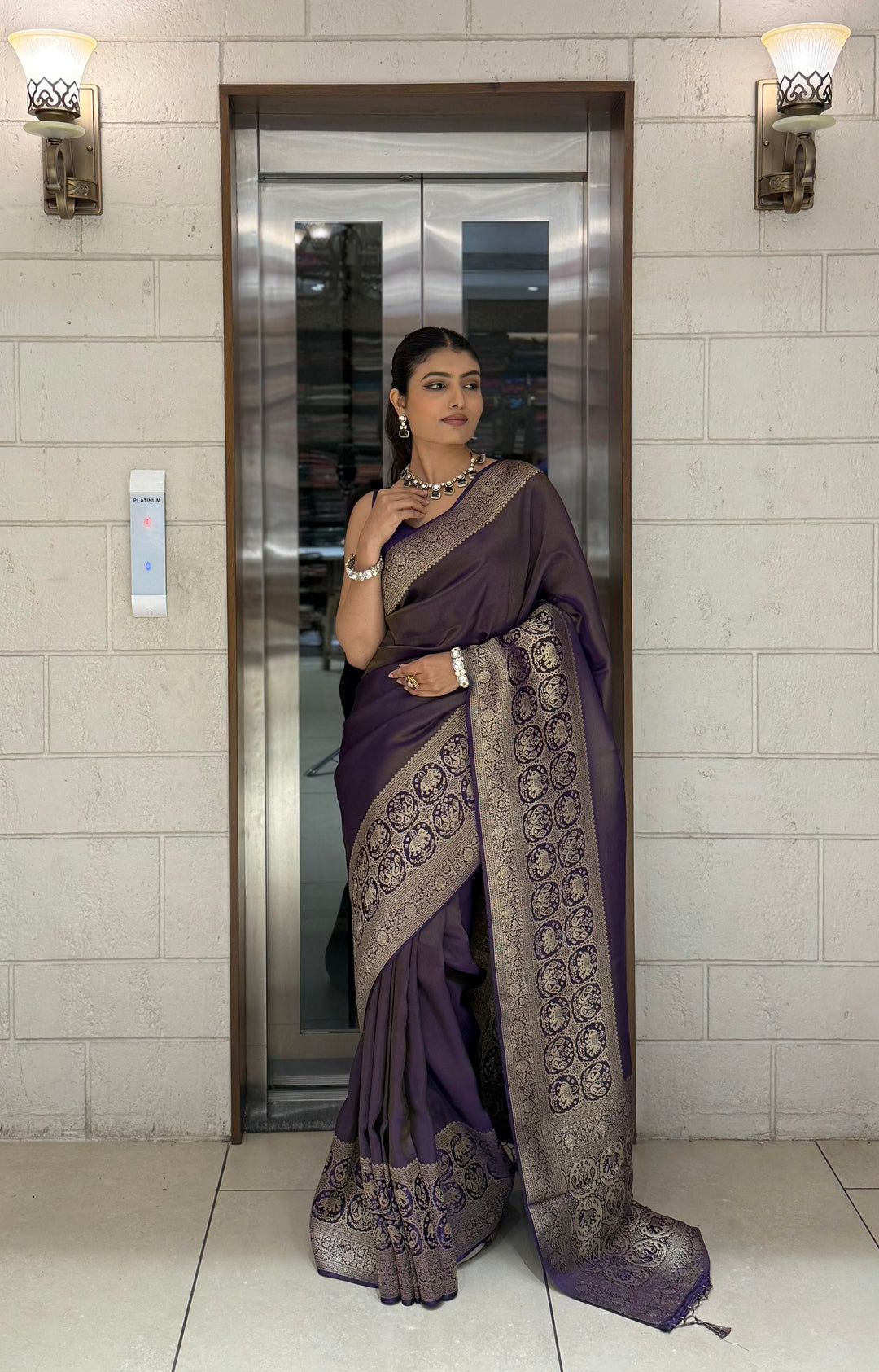Majestic Plum Kanjivaram Silk Saree with Antique Zari Border & Traditional Motifs