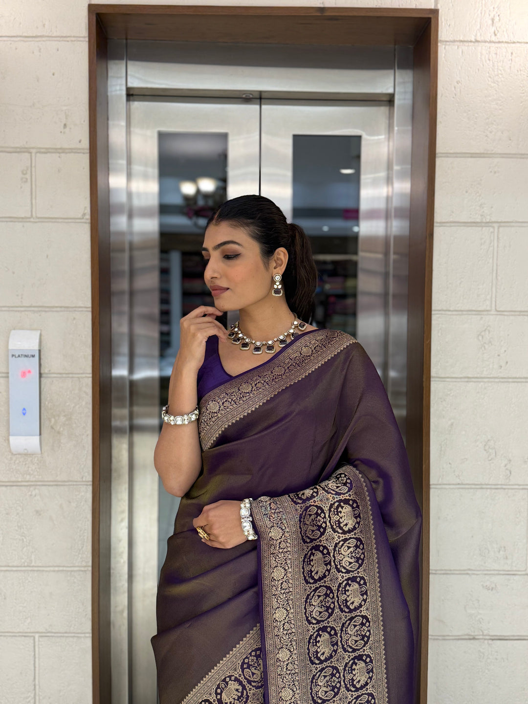 Majestic Plum Kanjivaram Silk Saree with Antique Zari Border & Traditional Motifs