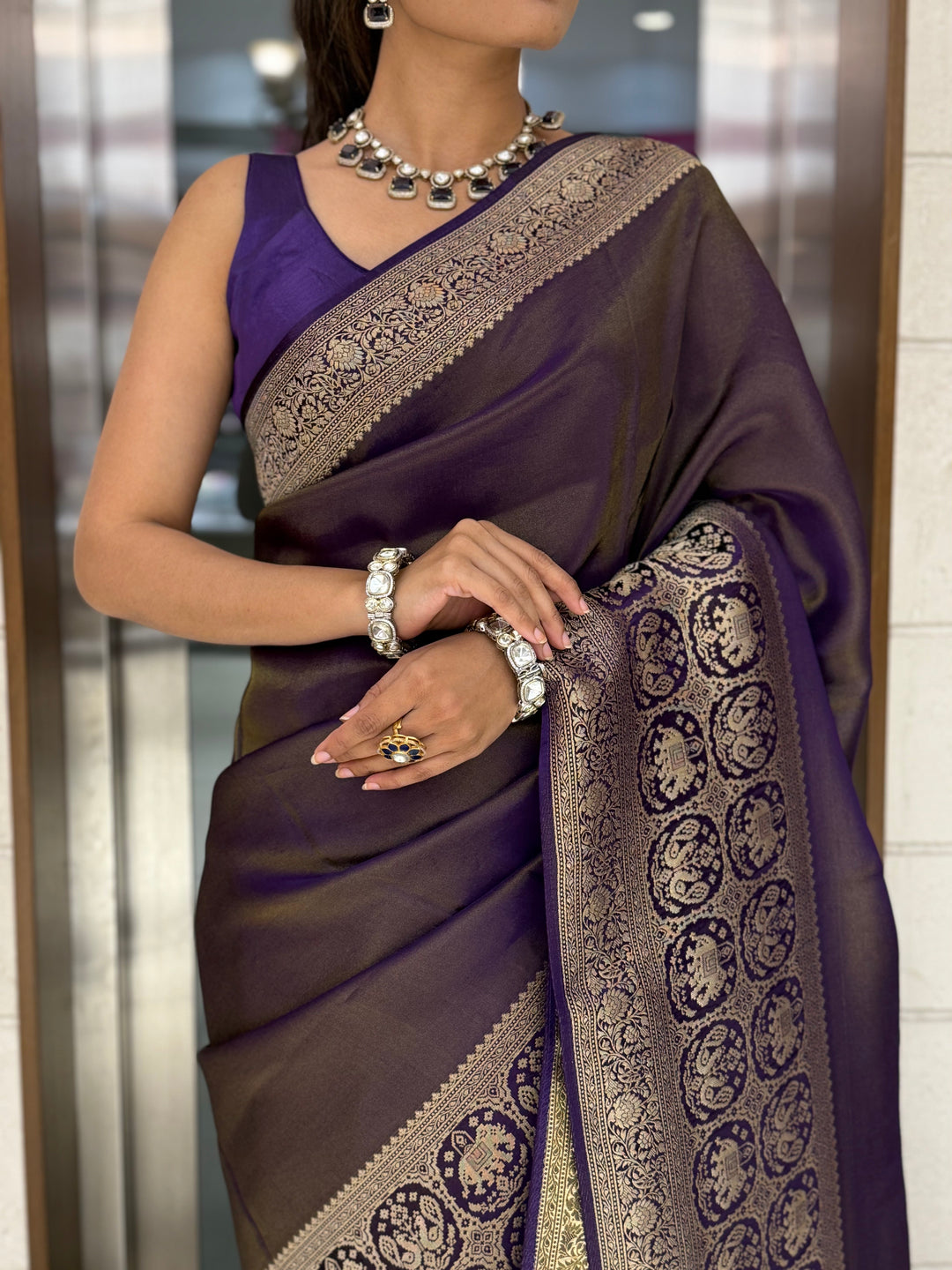 Majestic Plum Kanjivaram Silk Saree with Antique Zari Border & Traditional Motifs