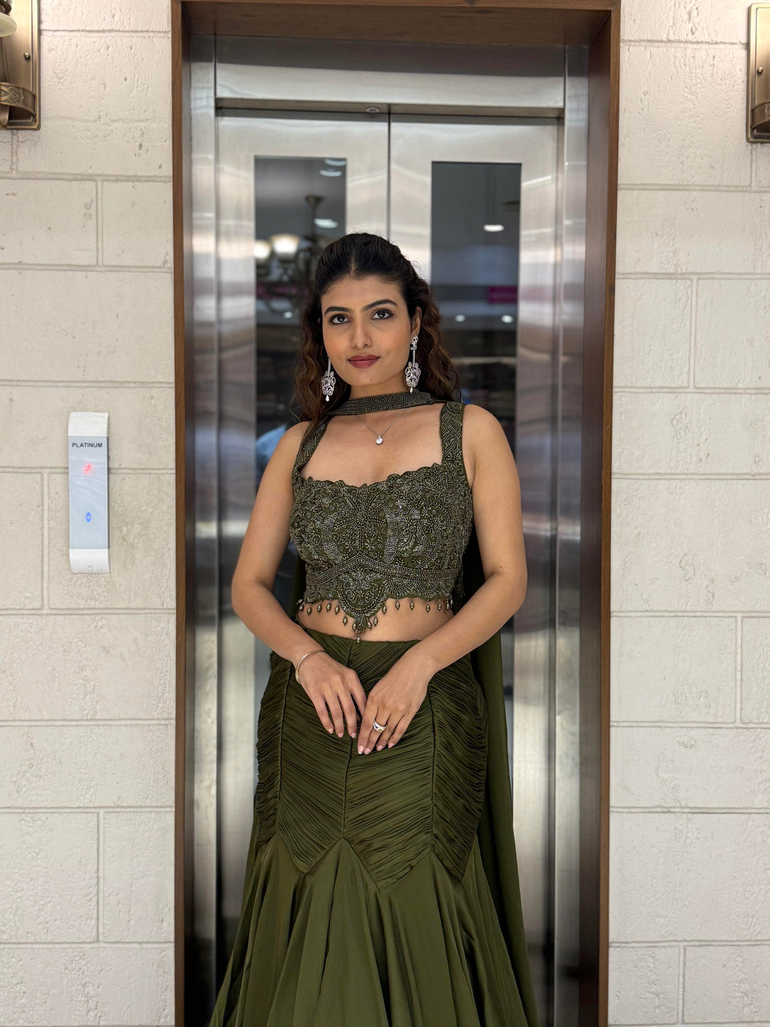 Olive Green Indo-Western Mermaid Gown with Embellished Corset & Draped Cape Sleeves