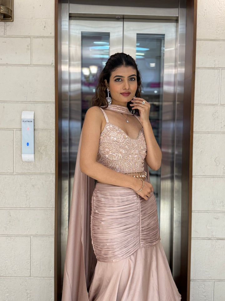 Blush Pink Indo-Western Layered Mermaid Gown with Embellished Corset & Draped Cape