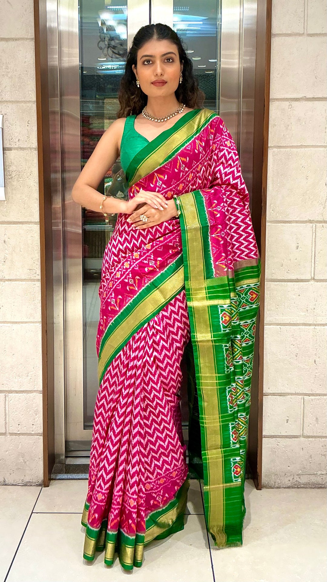 Rani Pink Ikkat Patola Silk Saree with Emerald Green Zari Border & Traditional Pallu