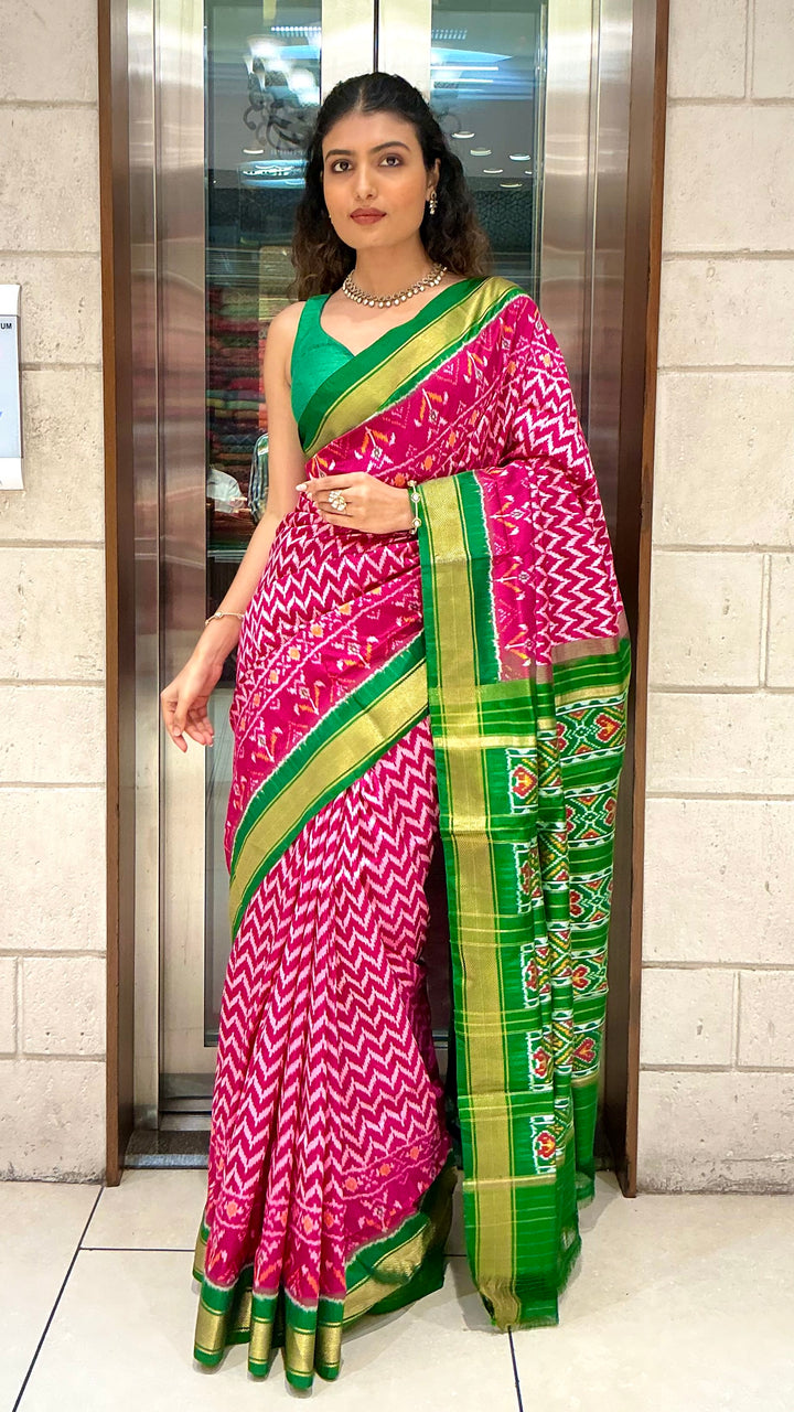 Rani Pink Ikkat Patola Silk Saree with Emerald Green Zari Border & Traditional Pallu