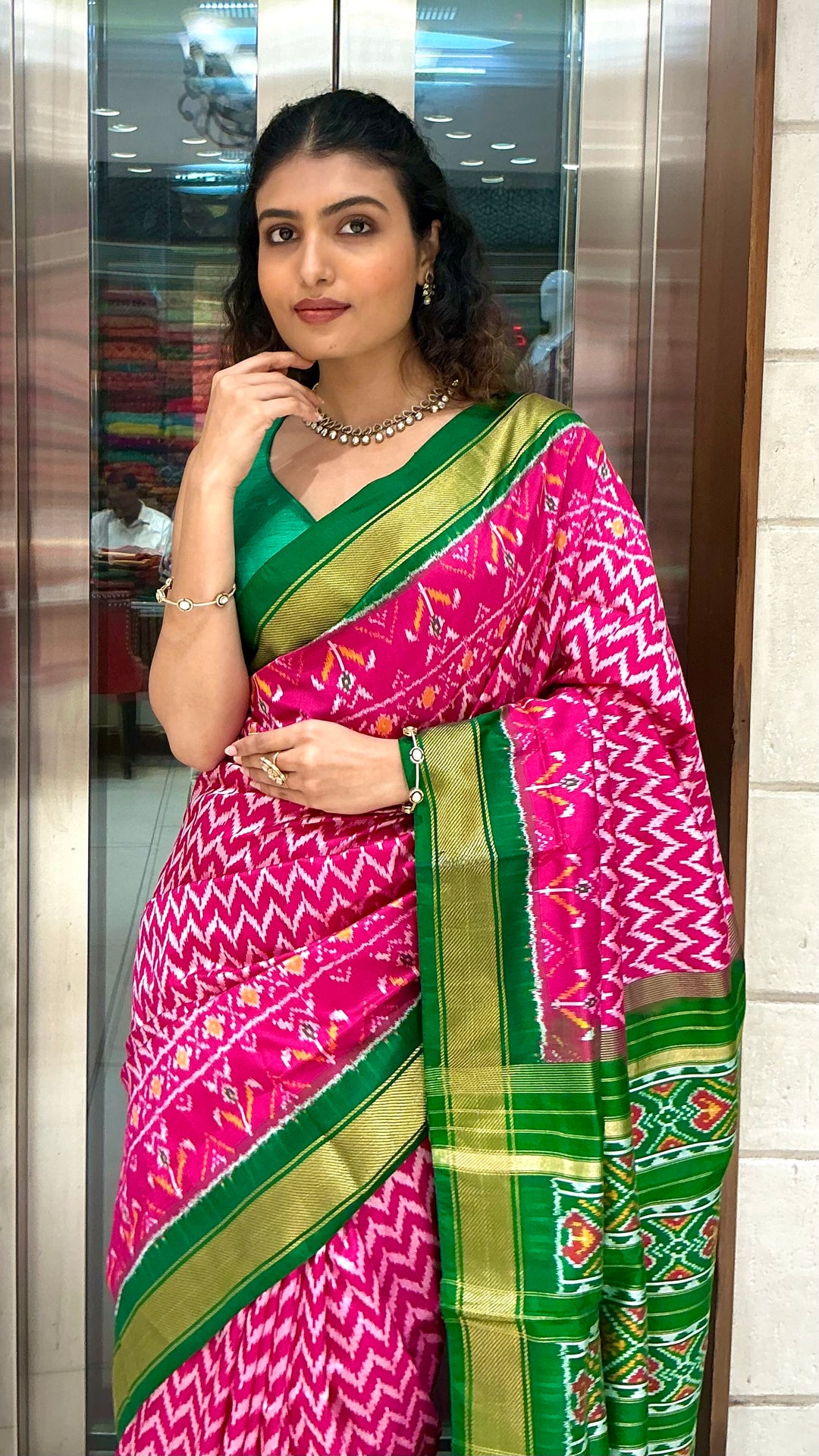 Rani Pink Ikkat Patola Silk Saree with Emerald Green Zari Border & Traditional Pallu