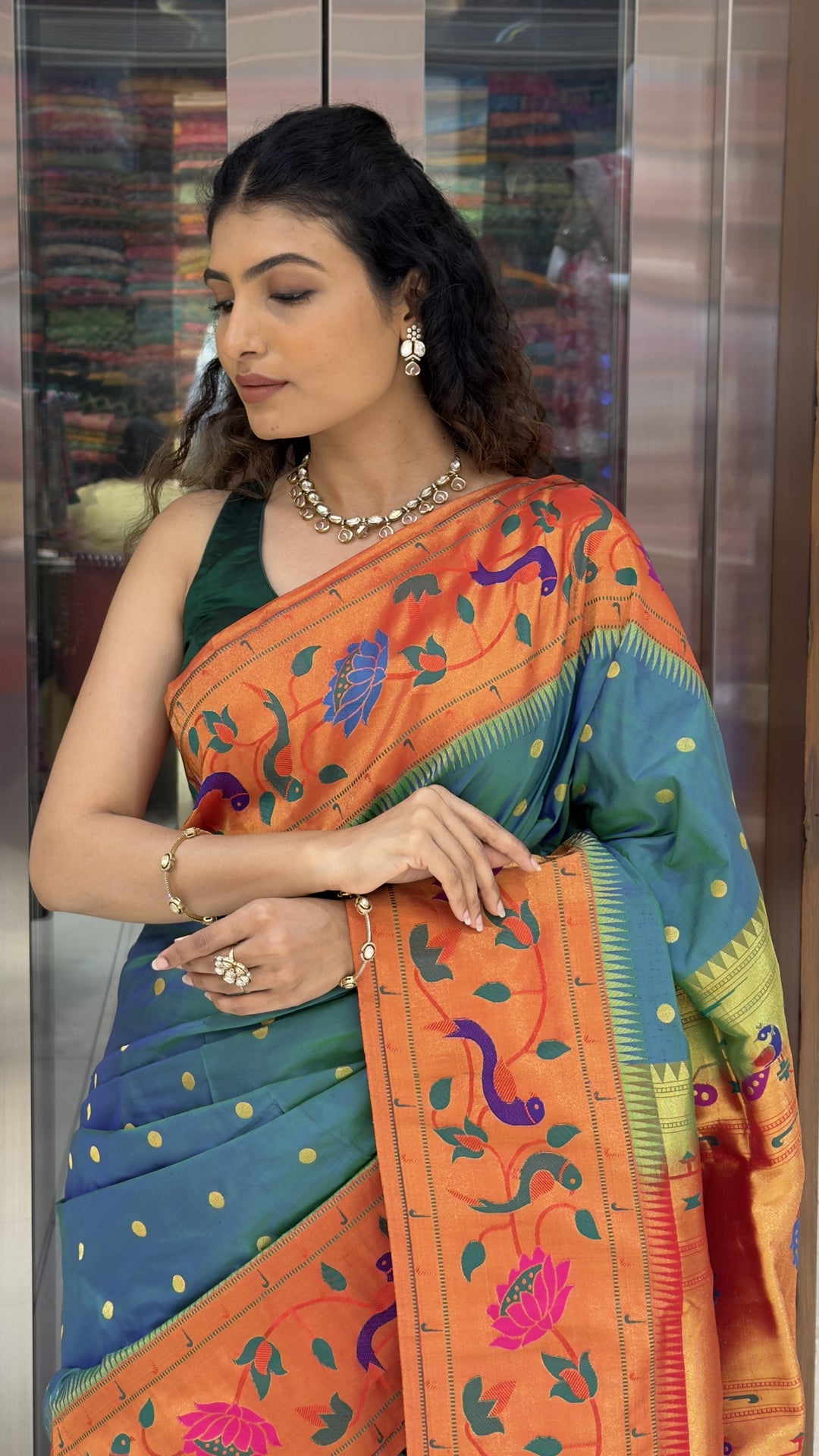 Teal Blue Paithani Silk Saree with Orange Peacock & Lotus Woven Border