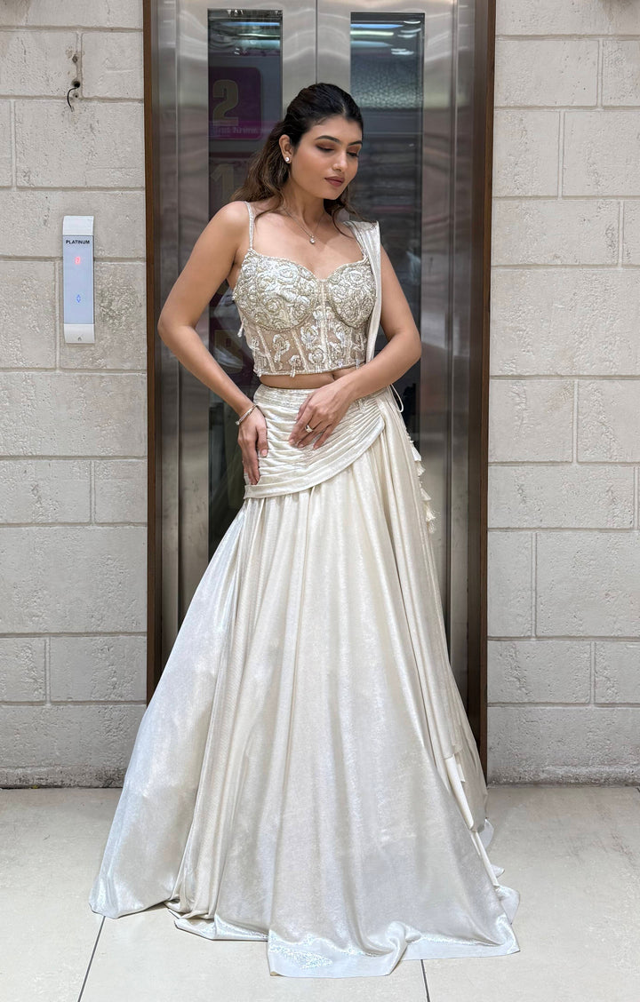 Ivory Shimmer Draped Lehenga Set with Hand-Embroidered Corset Blouse