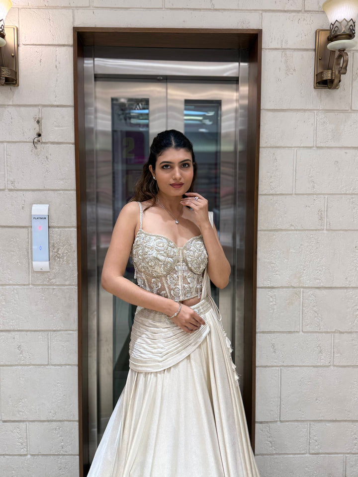 Ivory Shimmer Draped Lehenga Set with Hand-Embroidered Corset Blouse