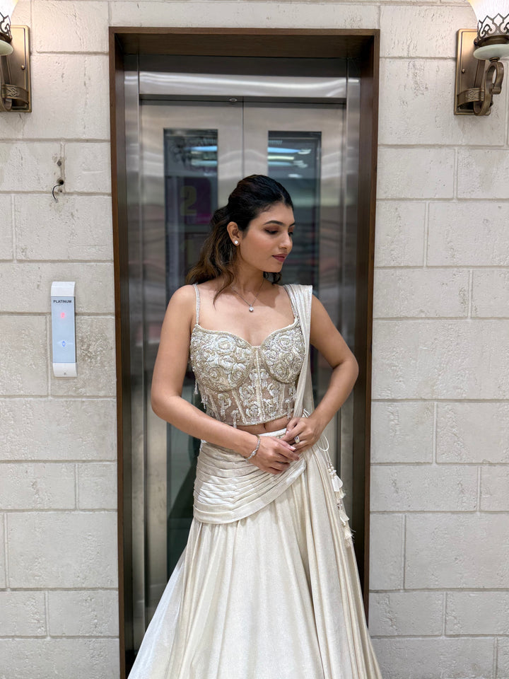 Ivory Shimmer Draped Lehenga Set with Hand-Embroidered Corset Blouse