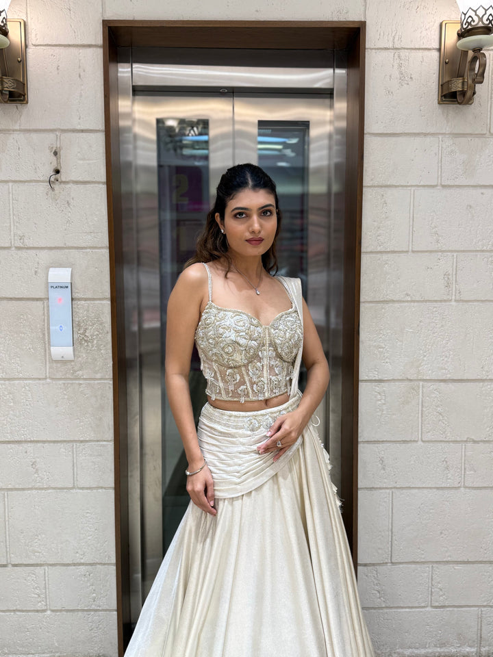 Ivory Shimmer Draped Lehenga Set with Hand-Embroidered Corset Blouse