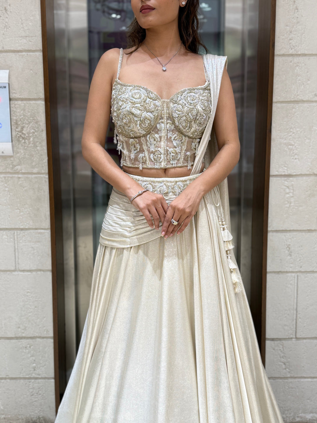 Ivory Shimmer Draped Lehenga Set with Hand-Embroidered Corset Blouse