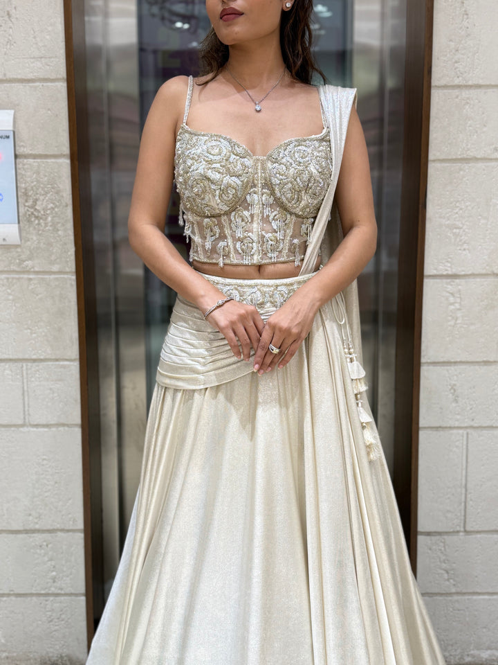 Ivory Shimmer Draped Lehenga Set with Hand-Embroidered Corset Blouse