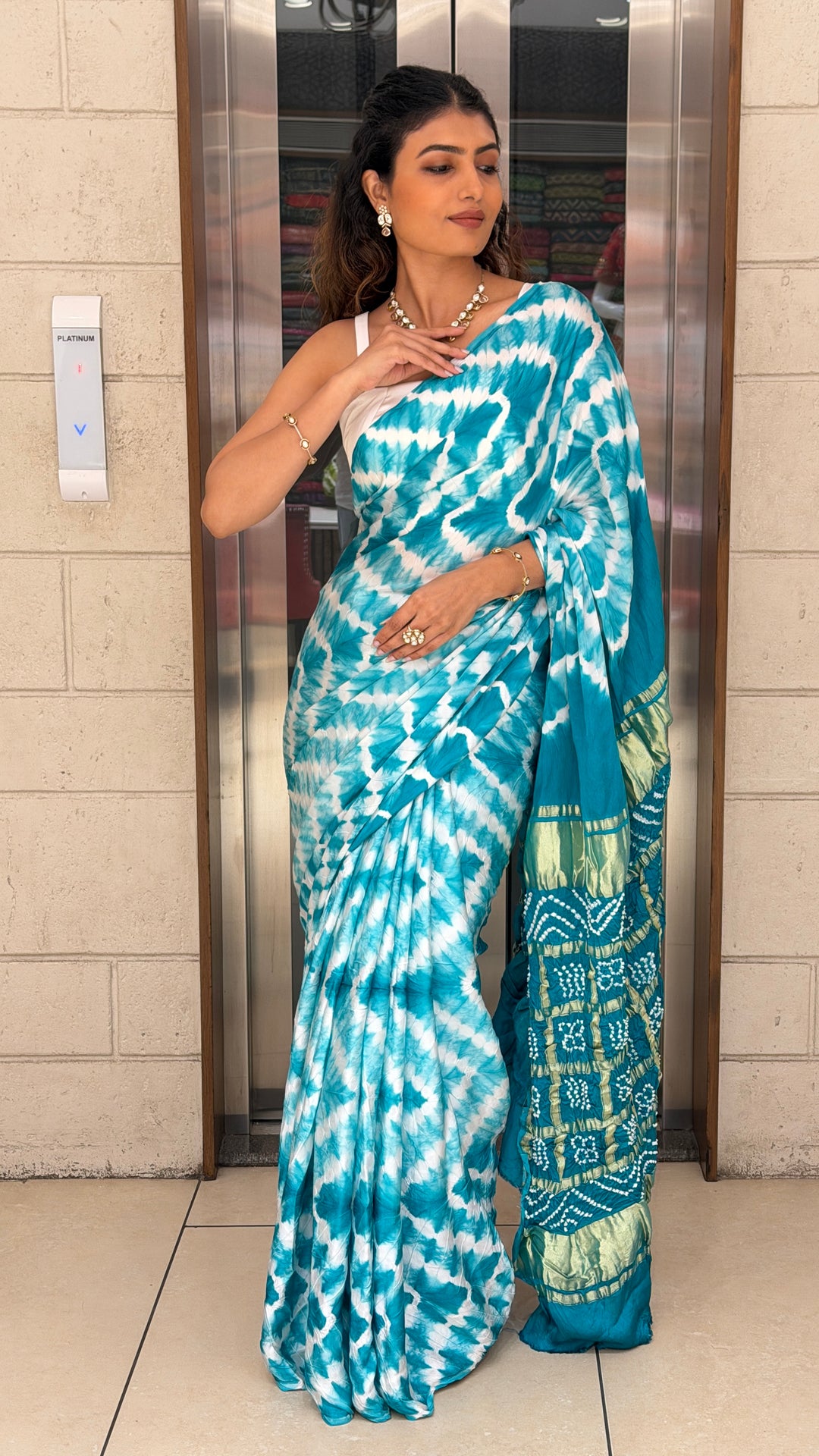 Turquoise Blue Bandhani Silk Saree with Zari Border & Traditional Pallu