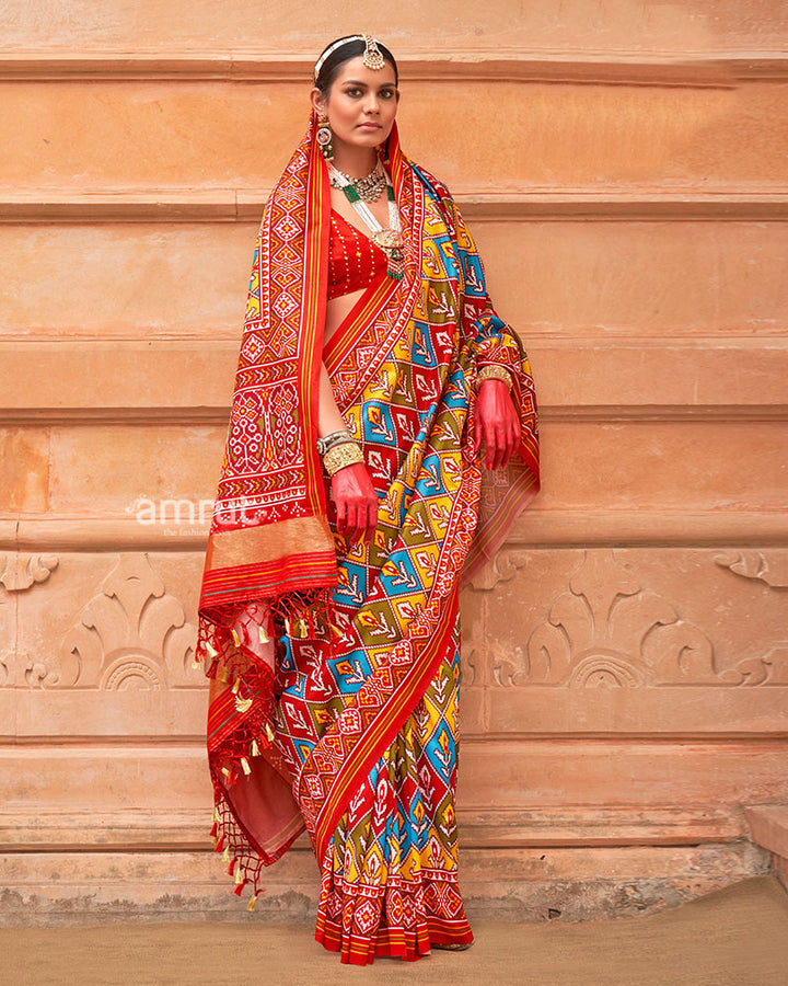 Multicolor Patola Print Traditional Saree With Red Zari Border and Unstitched Blouse 01