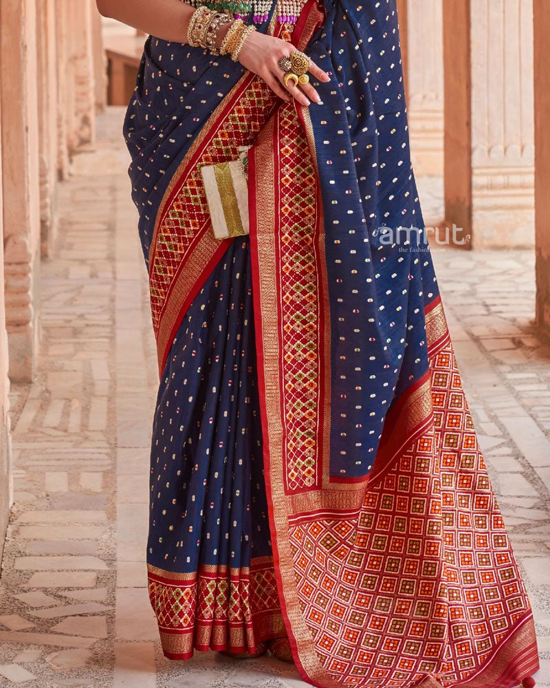 Navy Blue Printed Pure Patola Silk Saree With Red Contrast Zari Woven Pallu