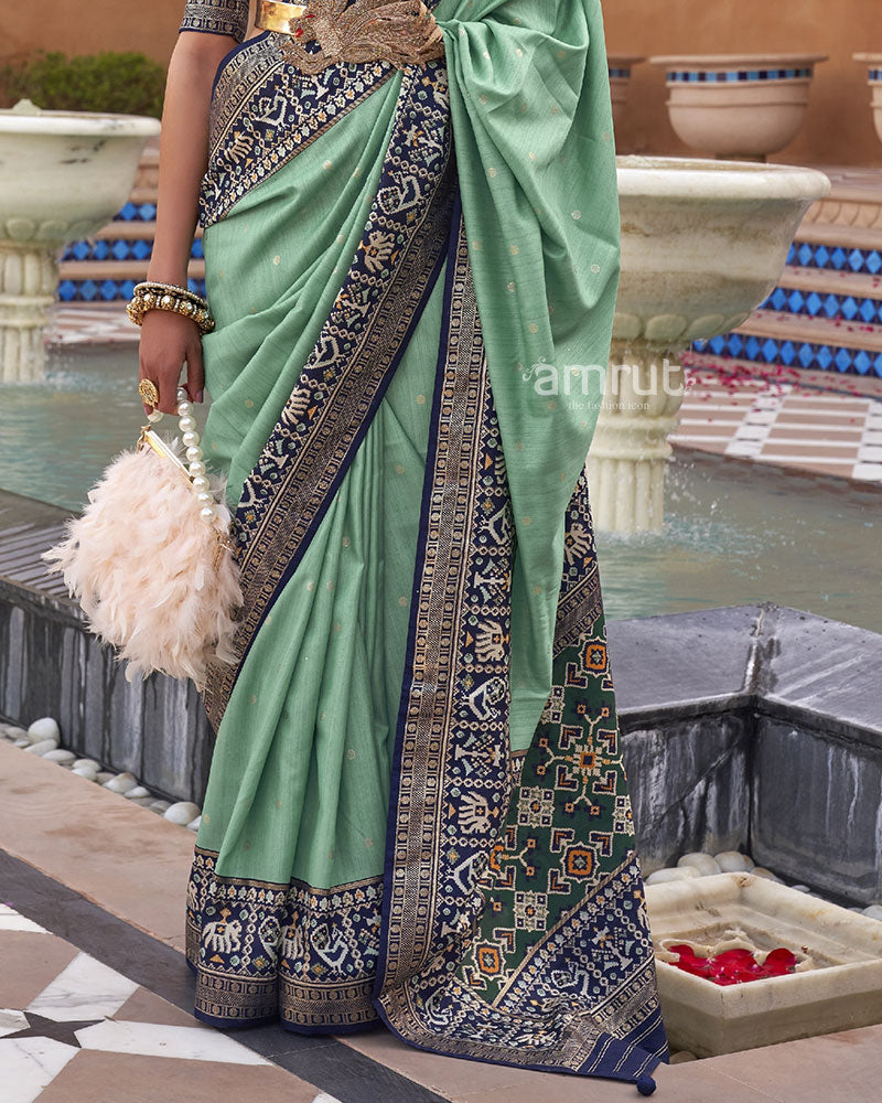 Sage Green Printed Patola Silk Saree With Blue Border and  Blouse Piece