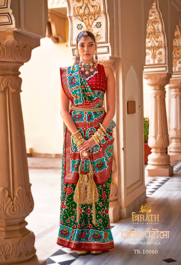 Crimson & Green Patola Silk Saree with Intricate Geometric Weaving, Paired with a Matching Blouse