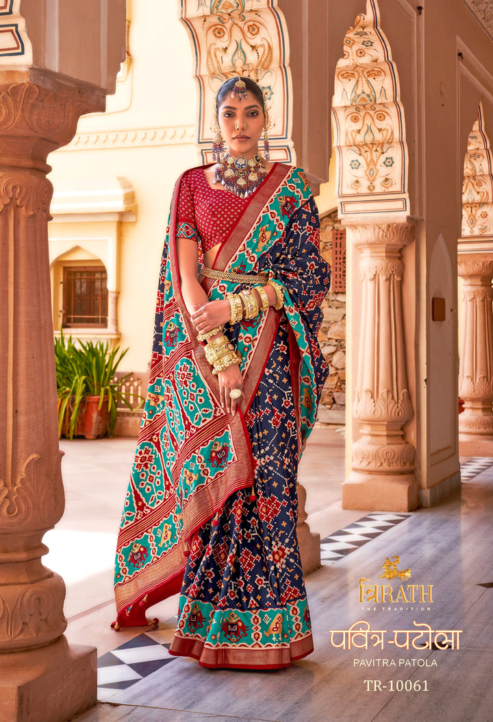 Navy Blue Patola Silk Saree with Intricate Geometric Weaving, Paired with a Matching Red Blouse