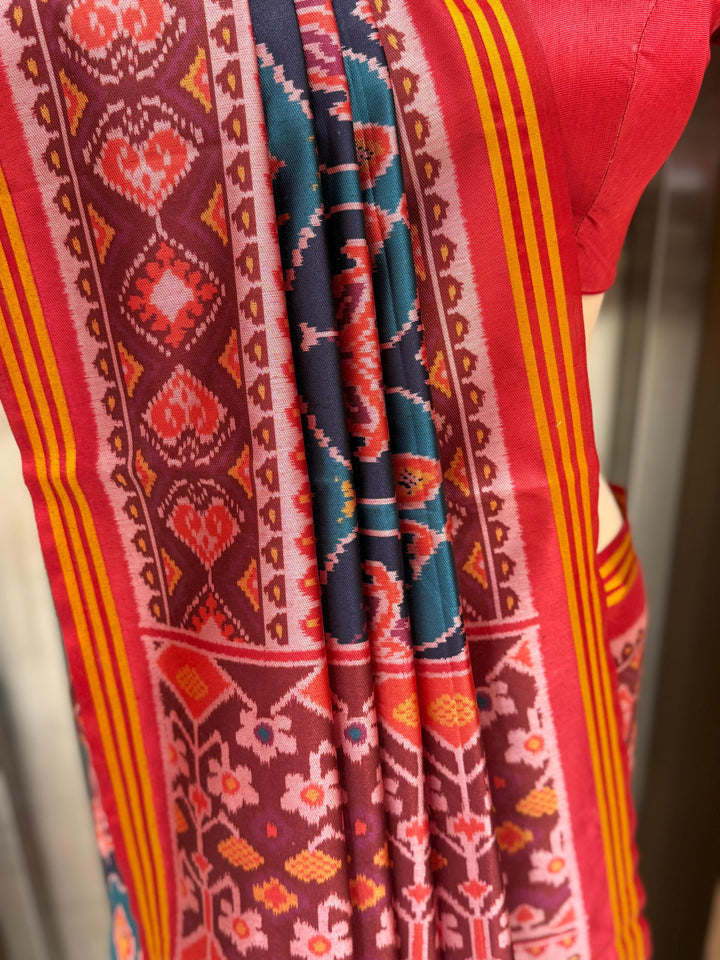 Teal Blue Patola Silk Saree with Reddish Embellished Border and Unstitched Blouse
